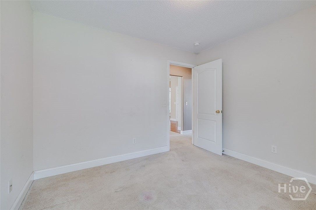 Bedroom with windows at 641 Marshview Dr.