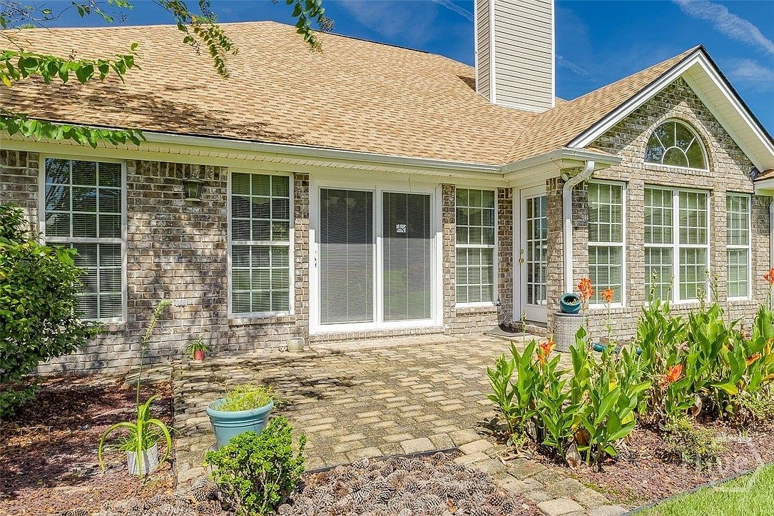 Patio and rear windows at 641 Marshview Dr.