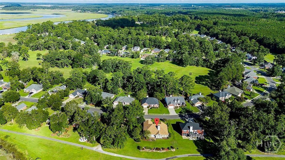 Aerial view of 641 Marshview Drive and the surrounding Richmond Hill neighborhood and marsh